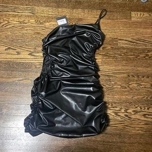 Faux leather mini dress with one shoulder strap and cutouts